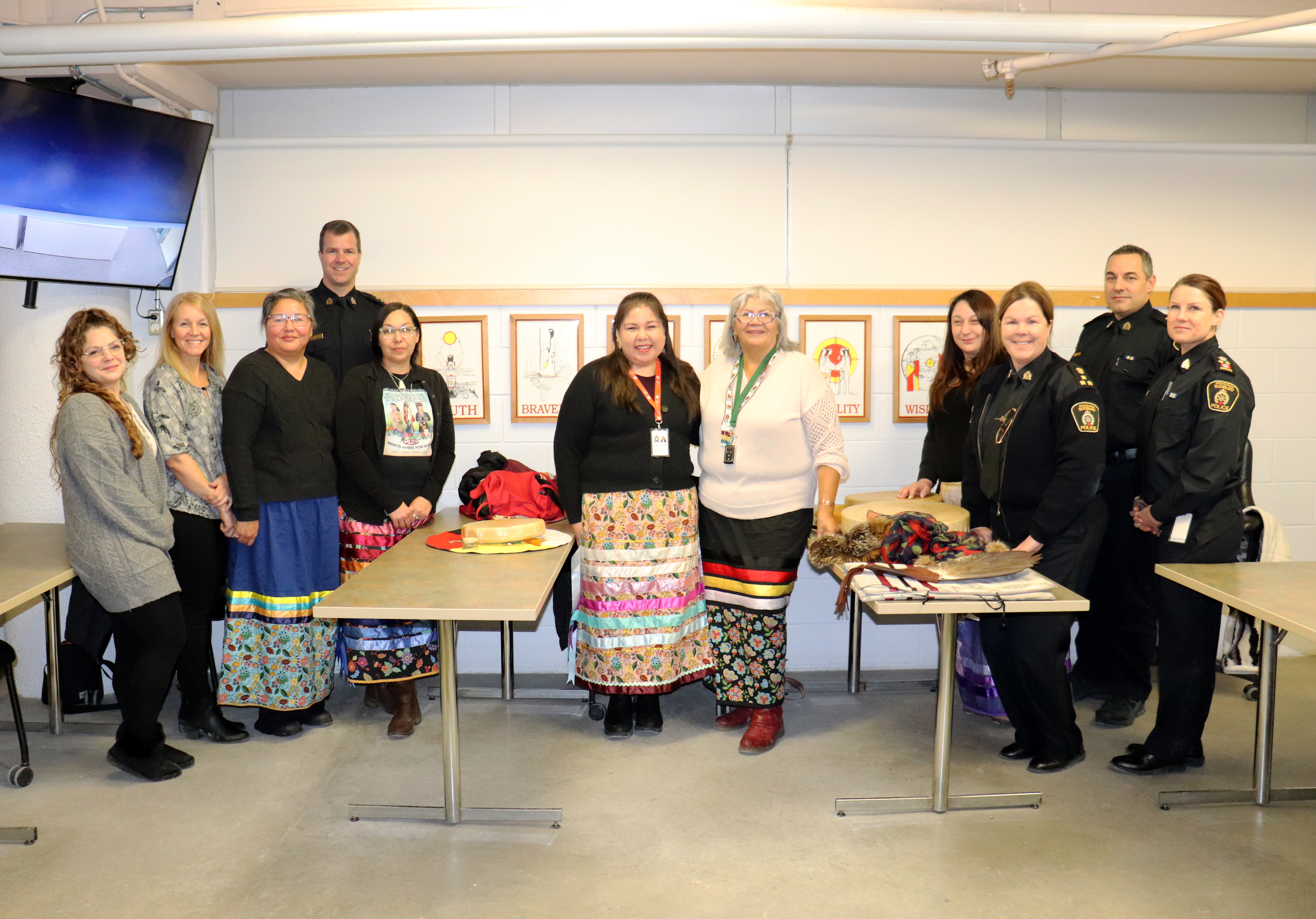 GSPS and Indigenous community members group of people standing in a room