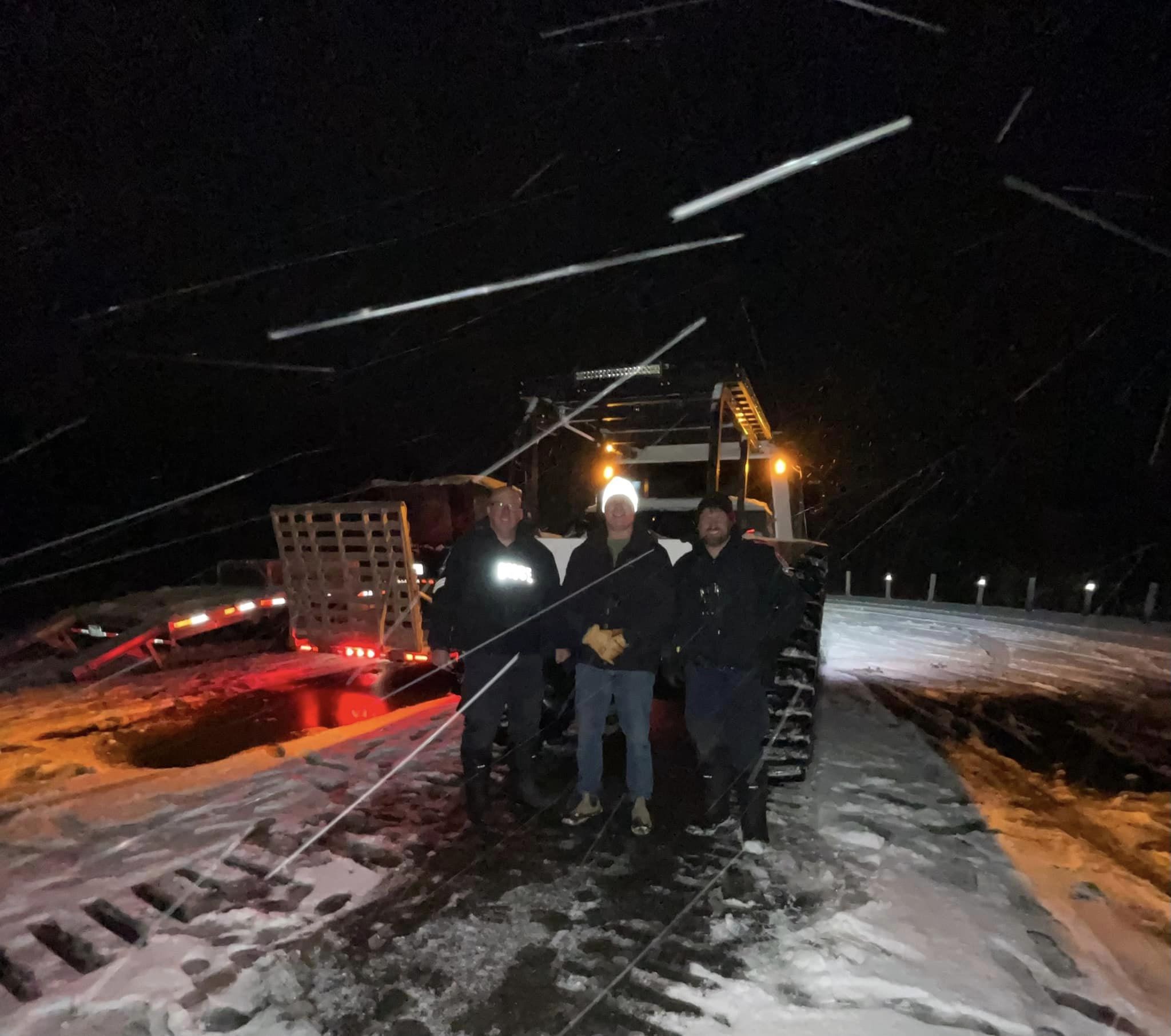 GSPS and RufDiamond Daryl Adams three men standing in front of fat truck in winter storm