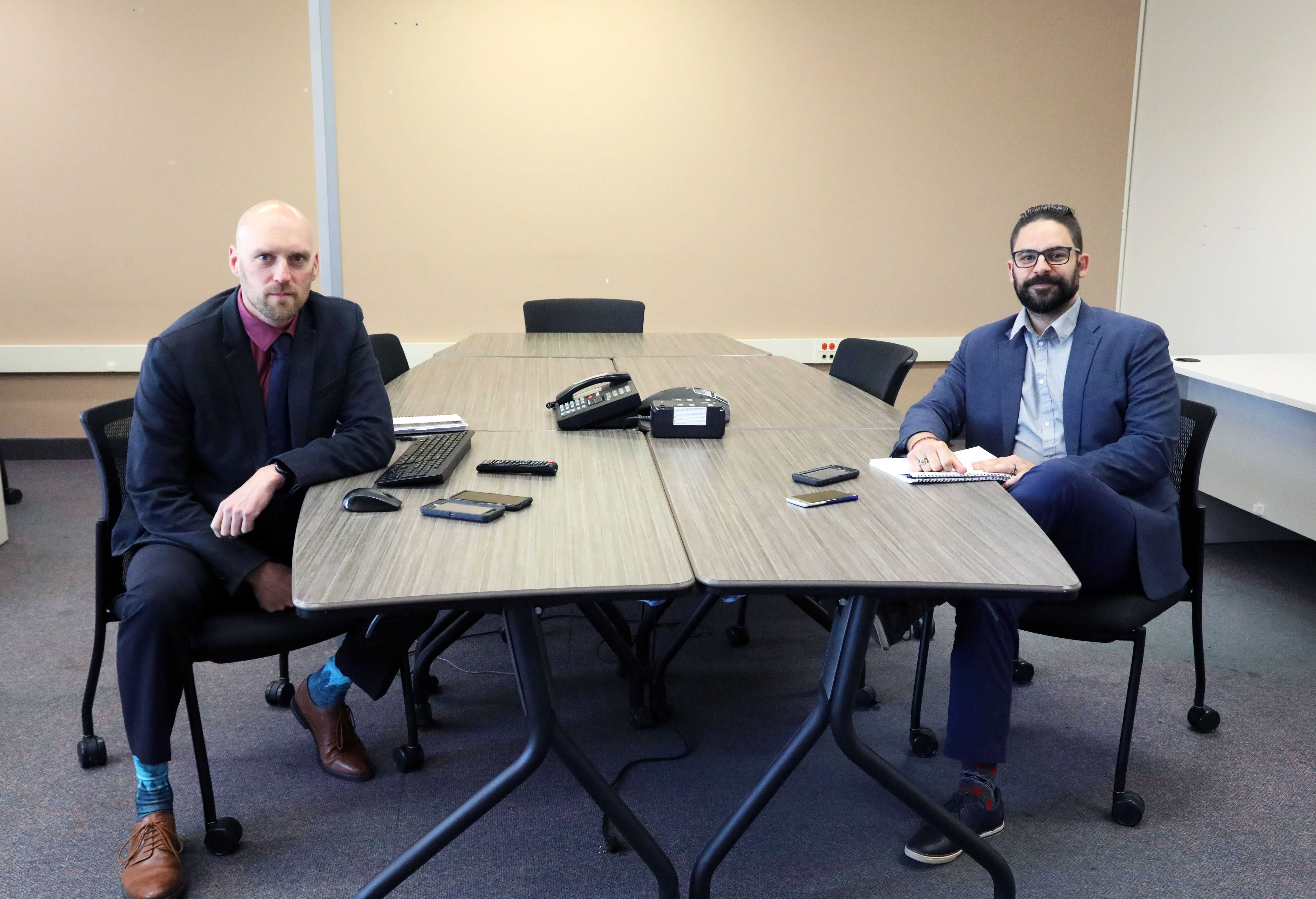 Detective Constable Clee Lieverse and Missing/Vulnerable Person Coordinator Eric Gosselin two men in suits sitting at table