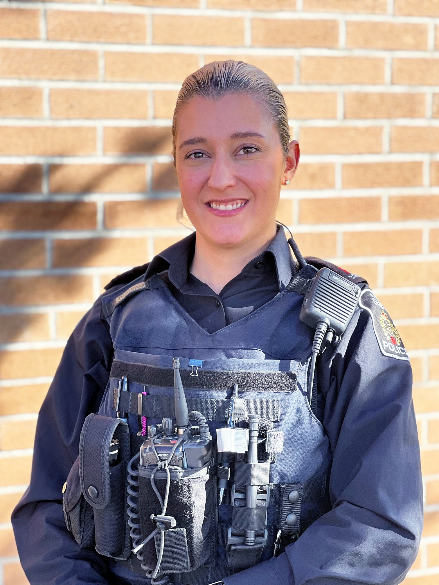 Constable Ashley Laberge female police officer in uniform smiling