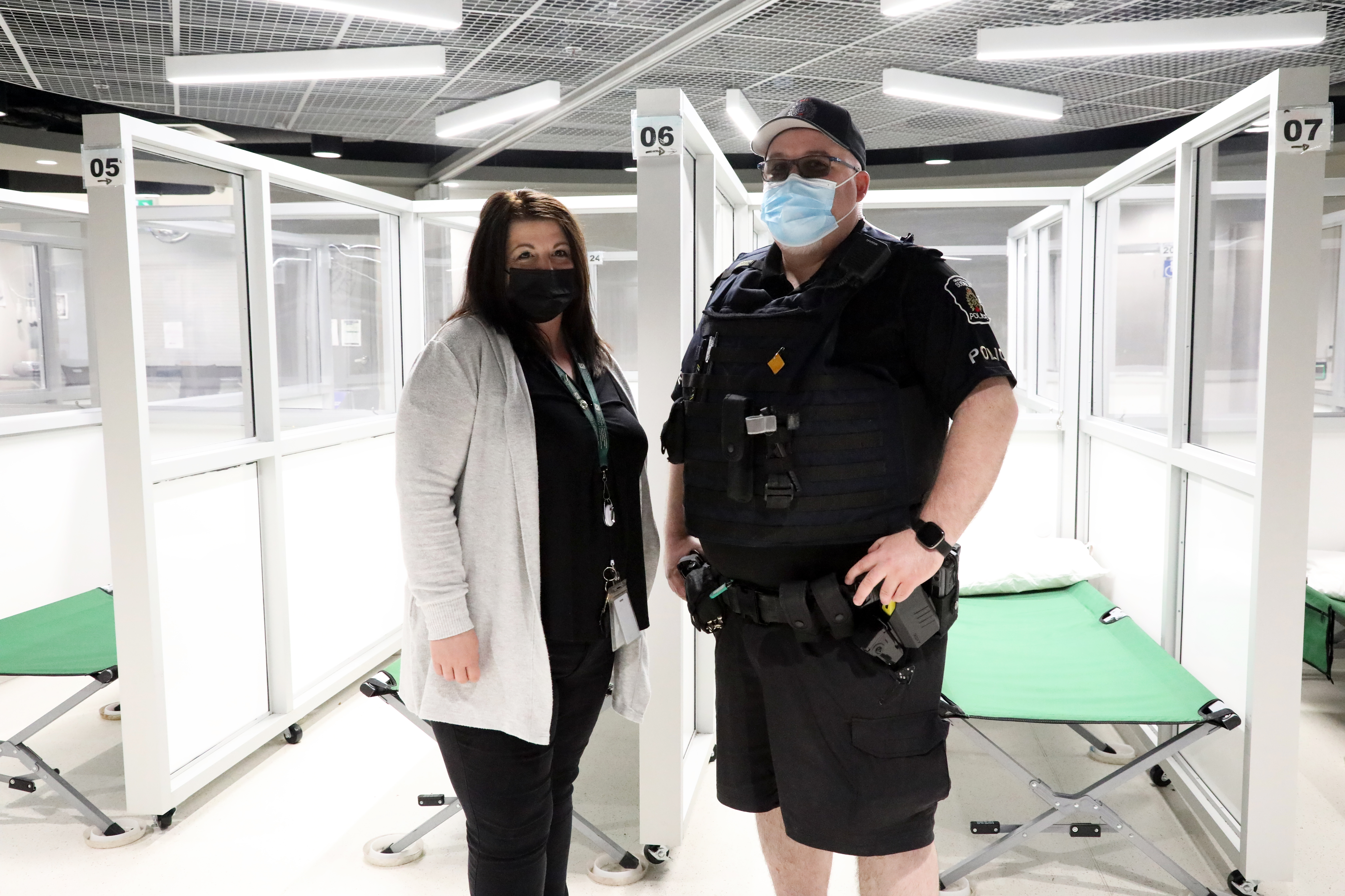 Jessica Kopechanski and Sergeant Matt Hall woman and man standing in shelter
