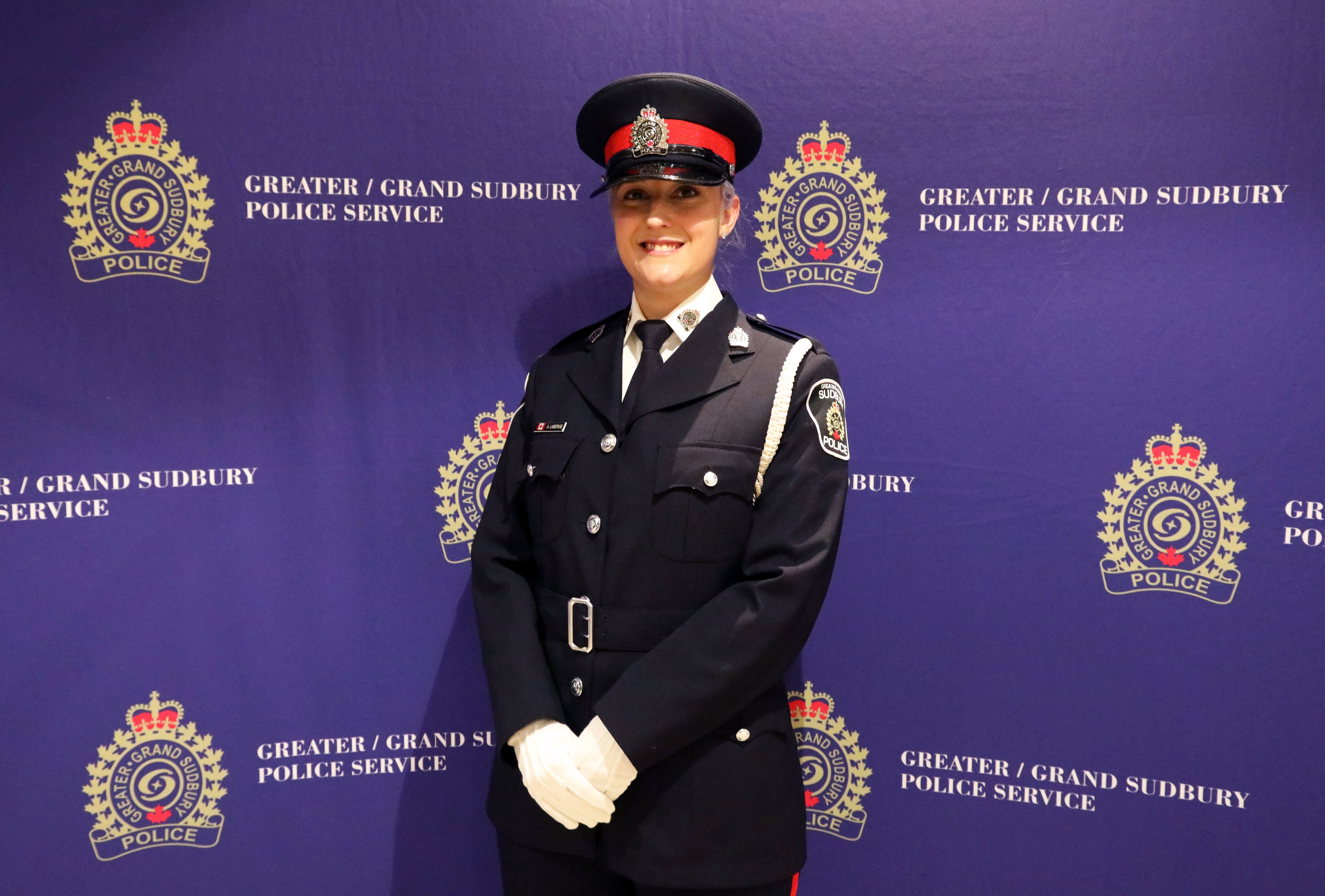 Cst. Ashley Laberge officer in uniform standing and smiling