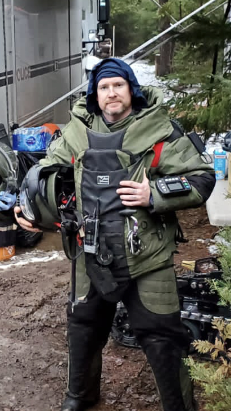 Constable Kyle Chandler police officer wearing bomb suit