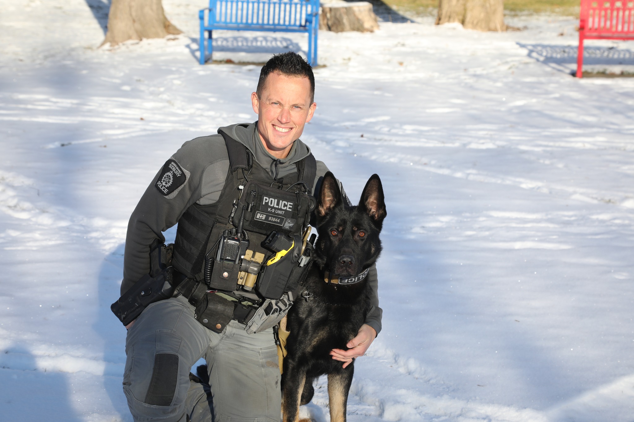 Constable Vitali and K9 Royal police officer and dog outside in snow