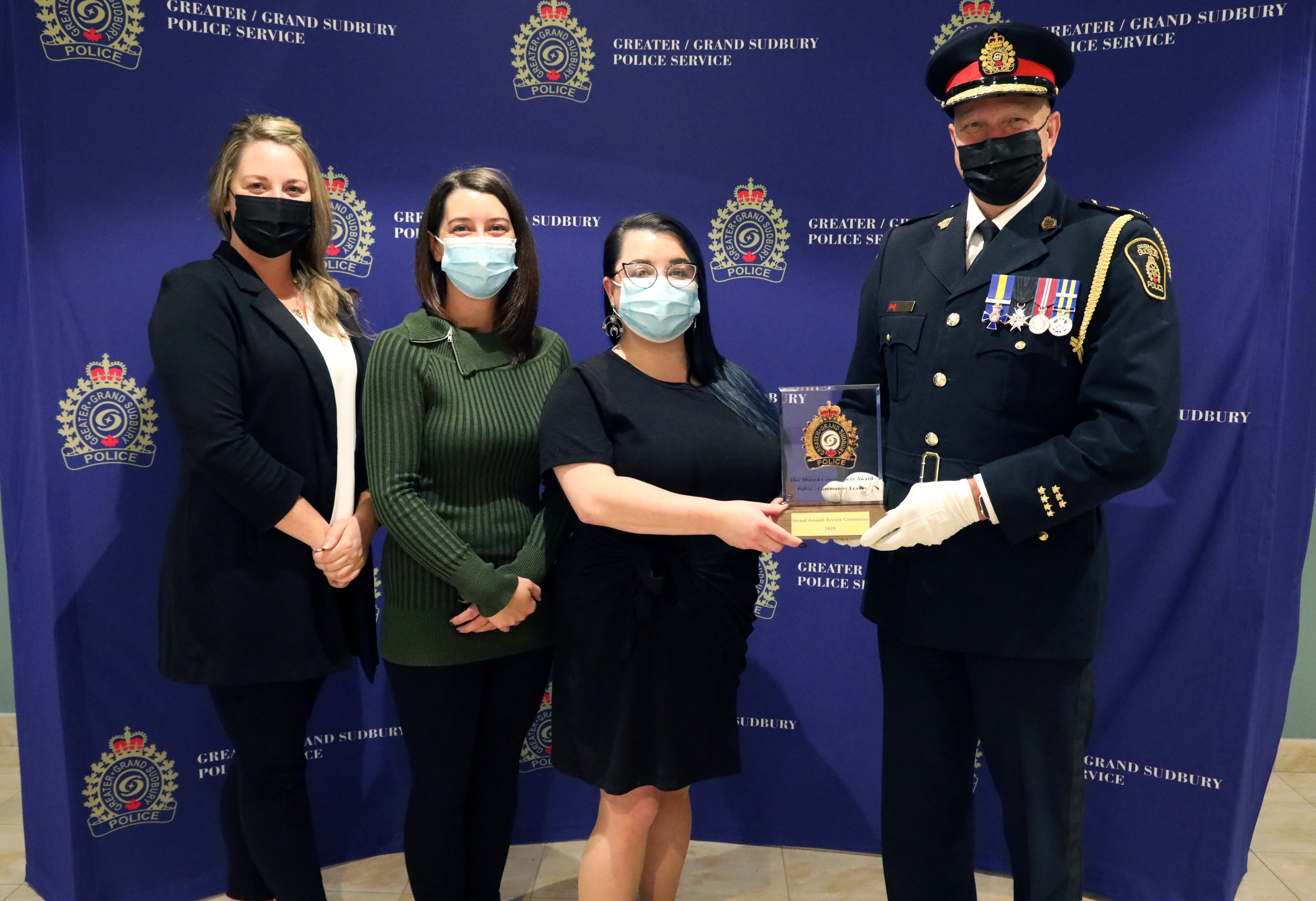 Sudbury and Area Victim Services women standing with chief of police