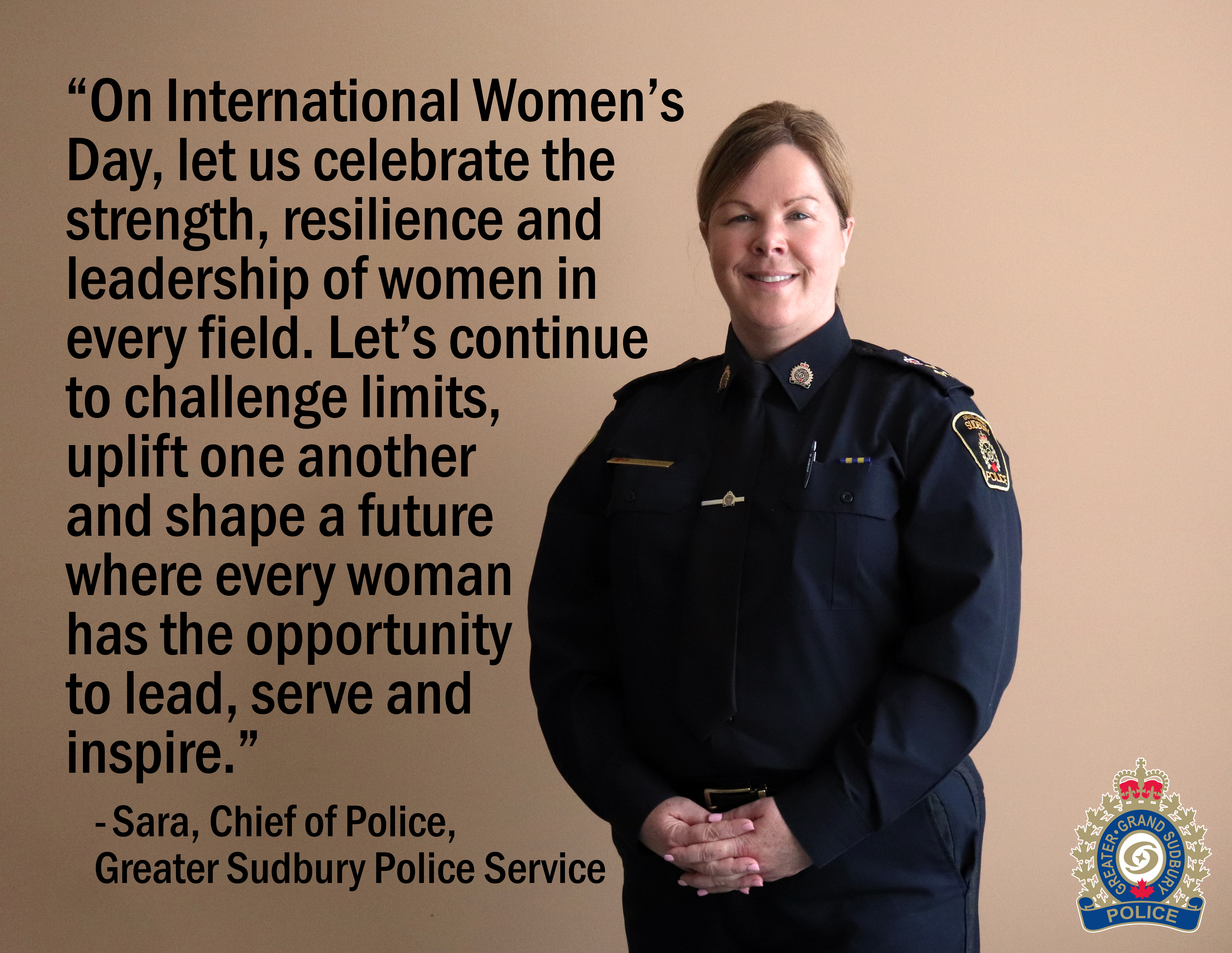 Chief Sara Cunningham female Chief of Police standing and smiling with text