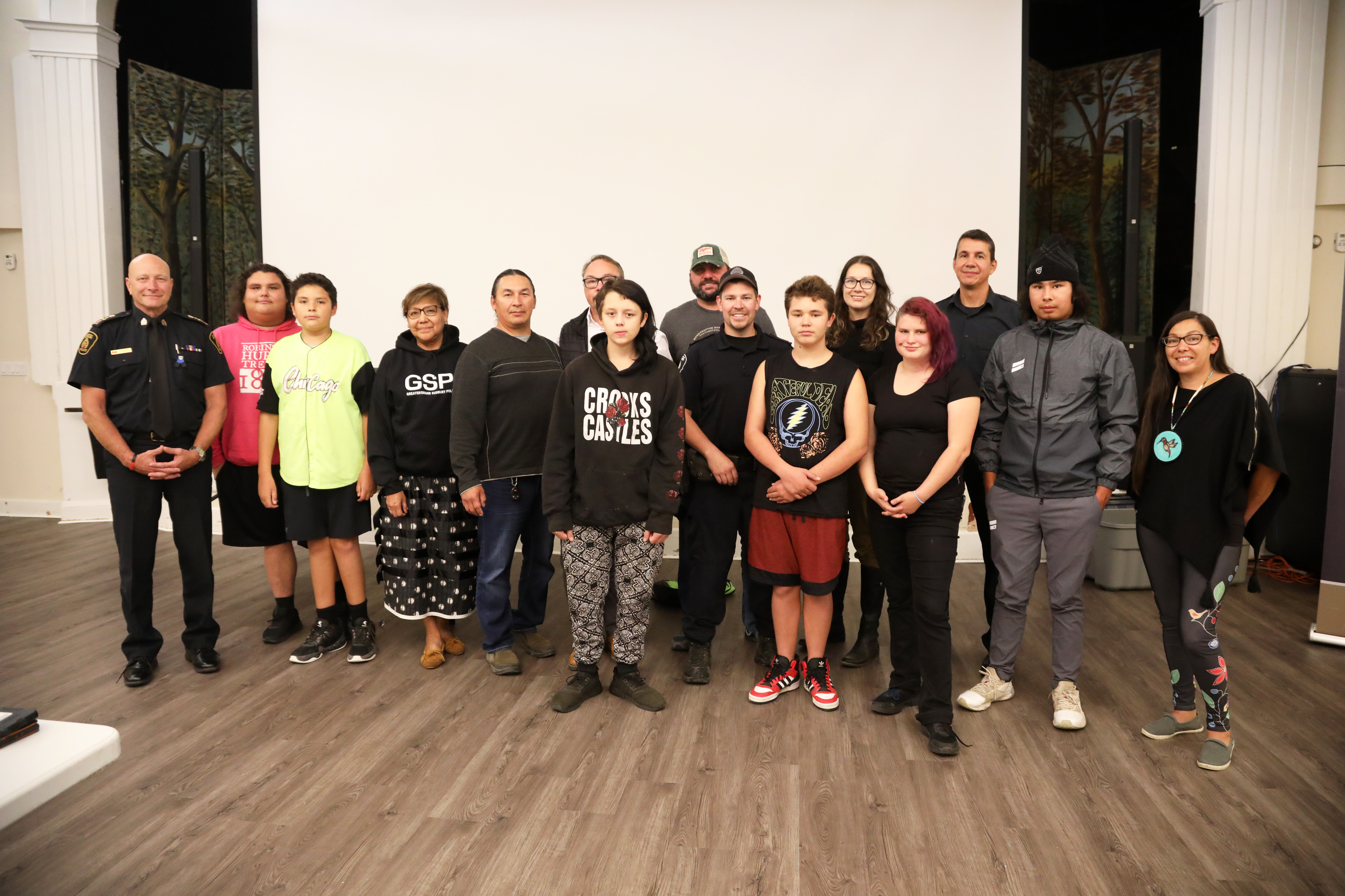 Mentors and youth group of people standing smiling